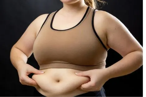 Focus sur la zone abdominale, illustration du stockage plus fréquent autour du ventre